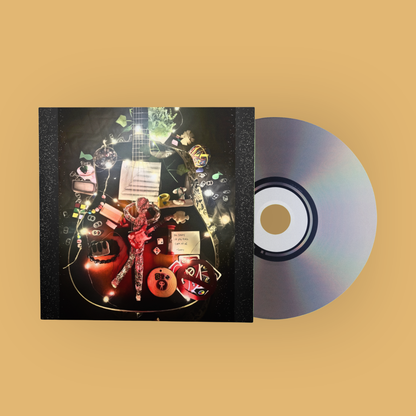 A square music album cover with a silver CD disc partially overlapping it, set against a solid warm beige background. The album cover features a highly detailed, surreal collage of a guitar, a metallic figure, musical notes, and small illustrated characters.